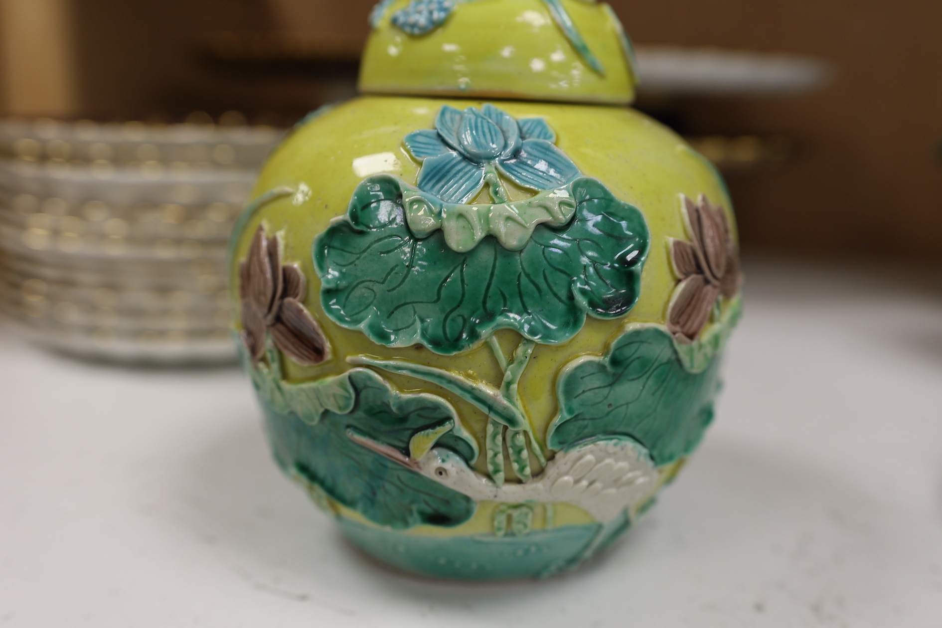 A Chinese polychrome glazed jar and cover, a Wangbinrong mark and a Japanese jar, jar and cover 14.5cm high. Condition - good